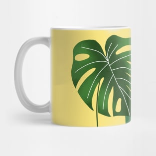 Monstera leaves on yellow Mug